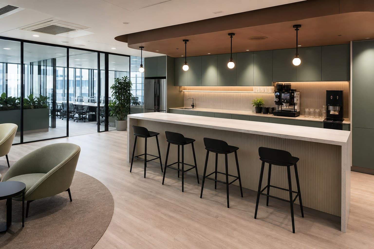 Modern Singapore office pantry with counter, bar stools, and soft seating beside glass partitions