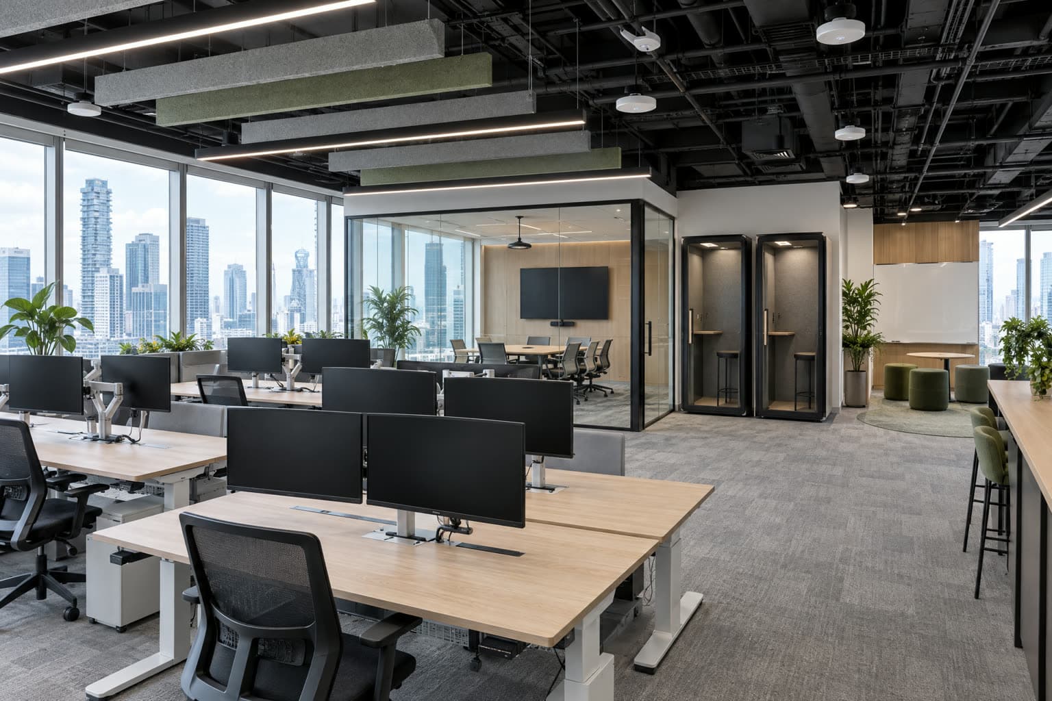Technology office fit-out in a Singapore tower with sit-stand desks and dual monitors, a glass video meeting room, phone booths, acoustic ceiling baffles and city views