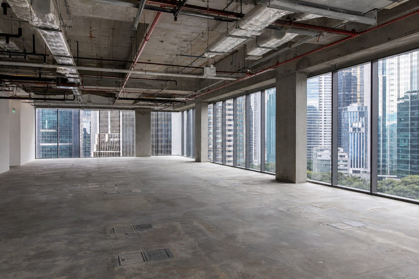 Singapore bare shell office unit showing landlord base-build services before tenant fit-out