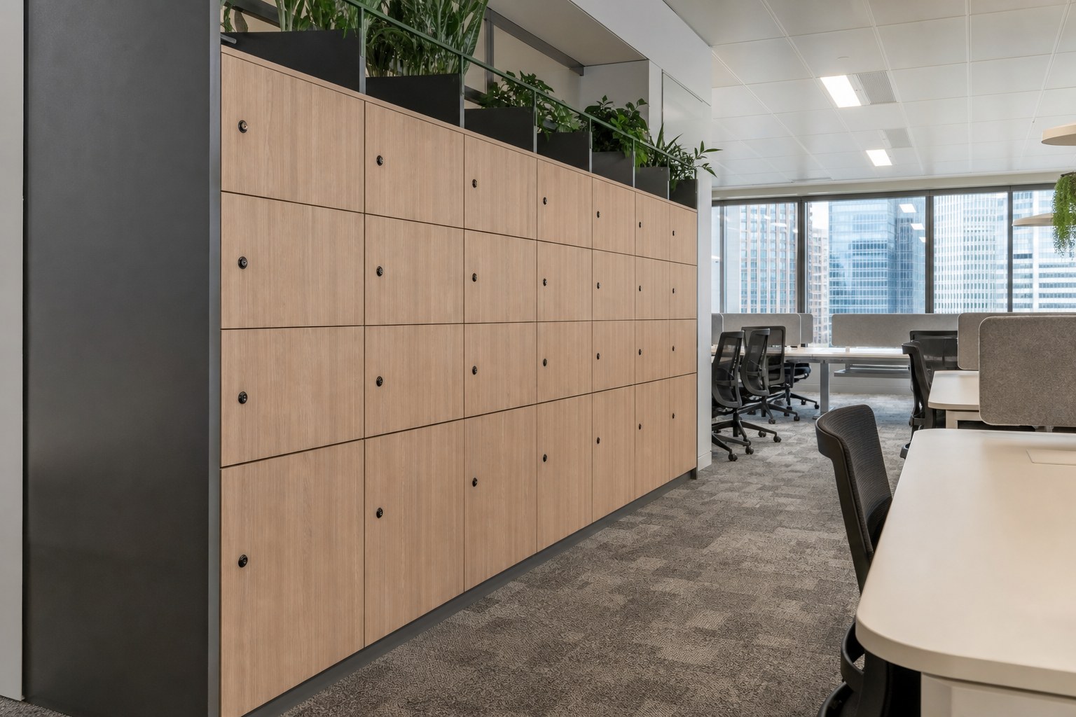 Personal lockers beside hot desks in a Singapore hybrid office