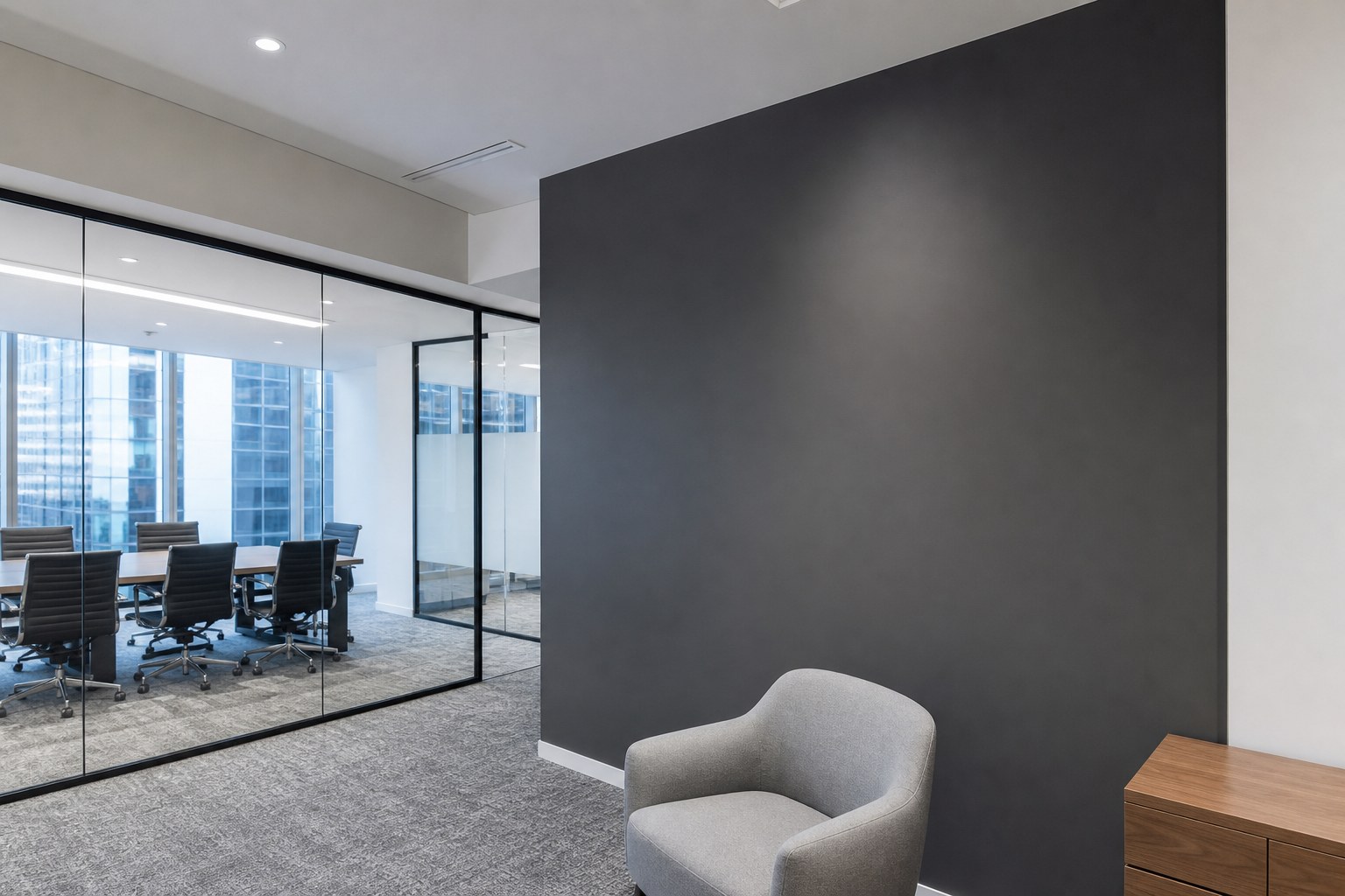 Muted charcoal feature wall in a Singapore commercial office fit-out